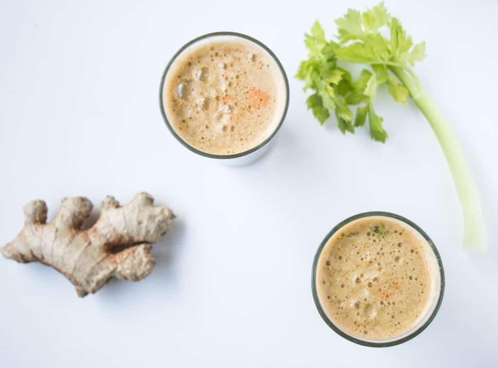 Super Detox Juice with fresh ginger and celery stalk