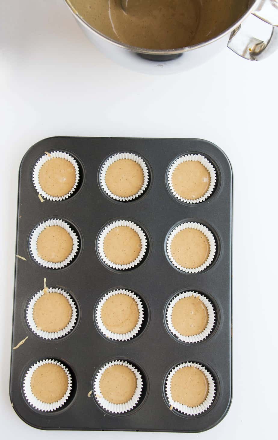 cupcake batter in a baking tray.
