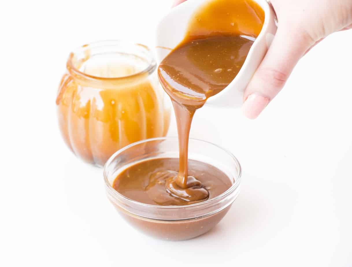 Vegan Salted Caramel being poured into a glass dish.