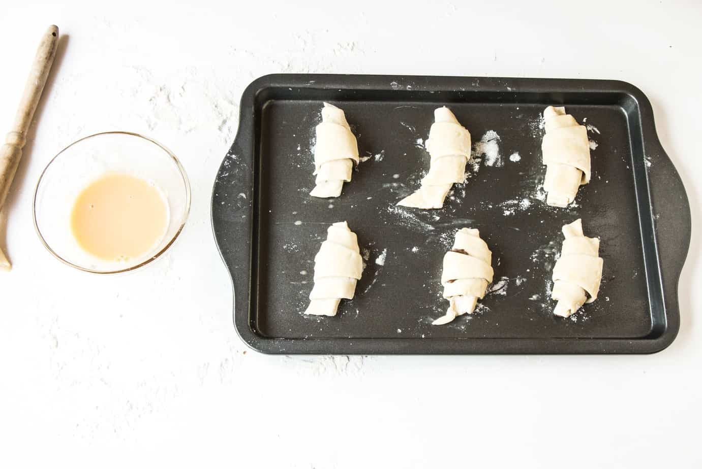 Easy Nutella Croissants ready for baking on a tray.