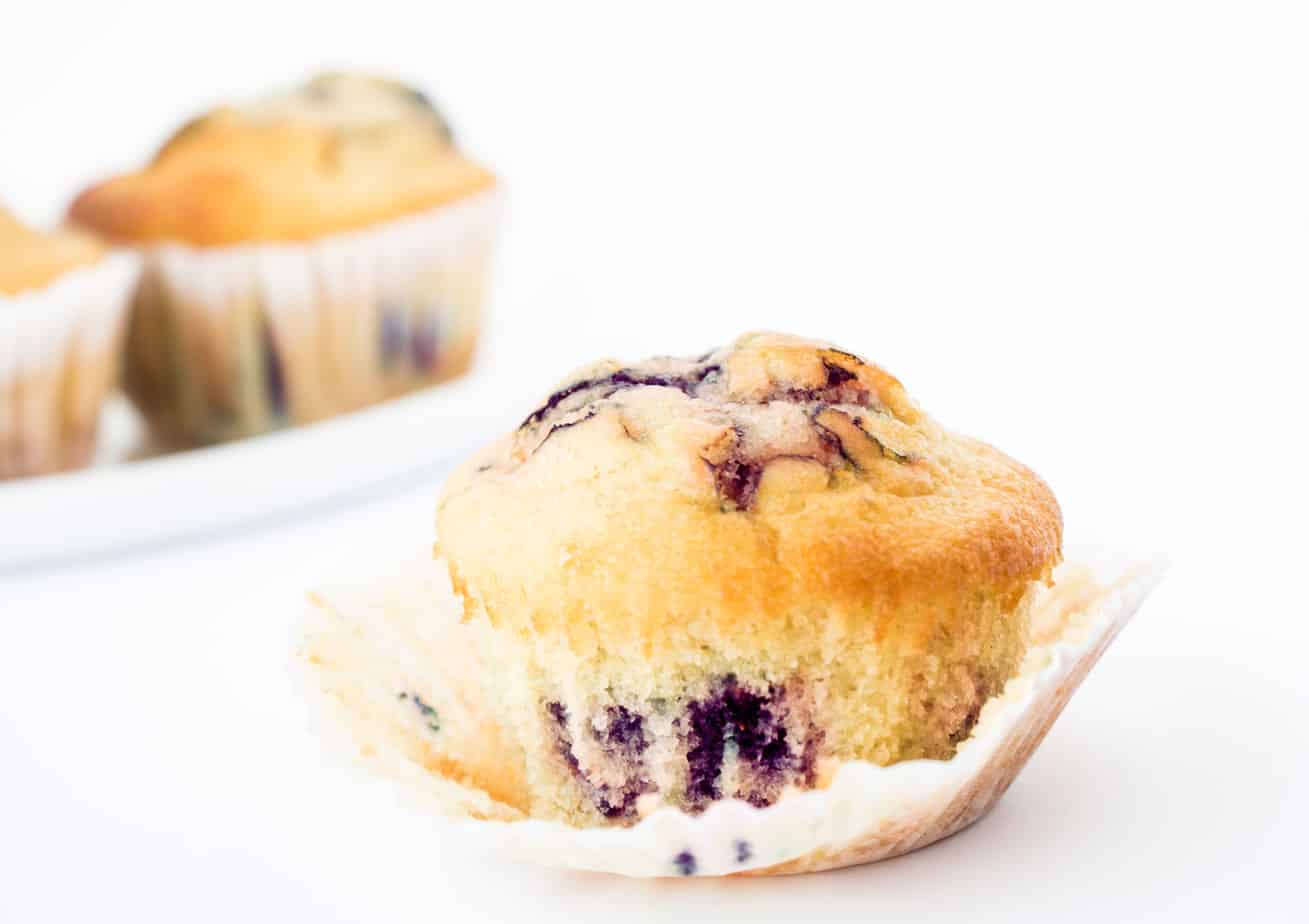 Healthy blueberry muffins in paper liners.