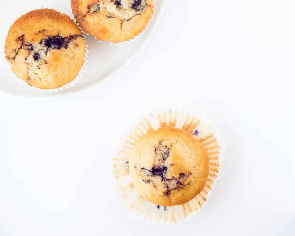 Healthy blueberry muffins on a white background.