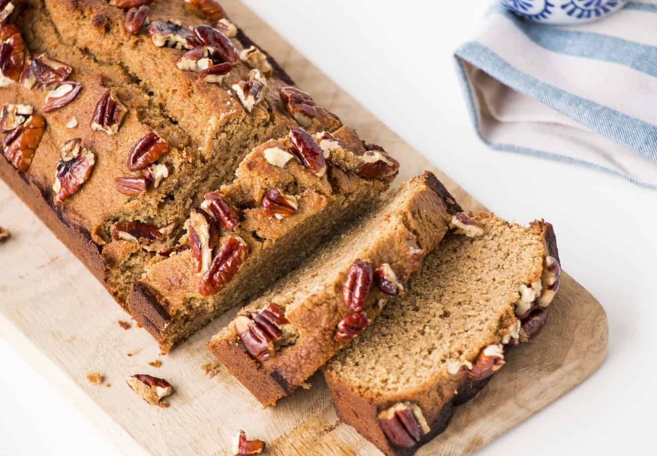 Banana Bread sliced and topped with pecans