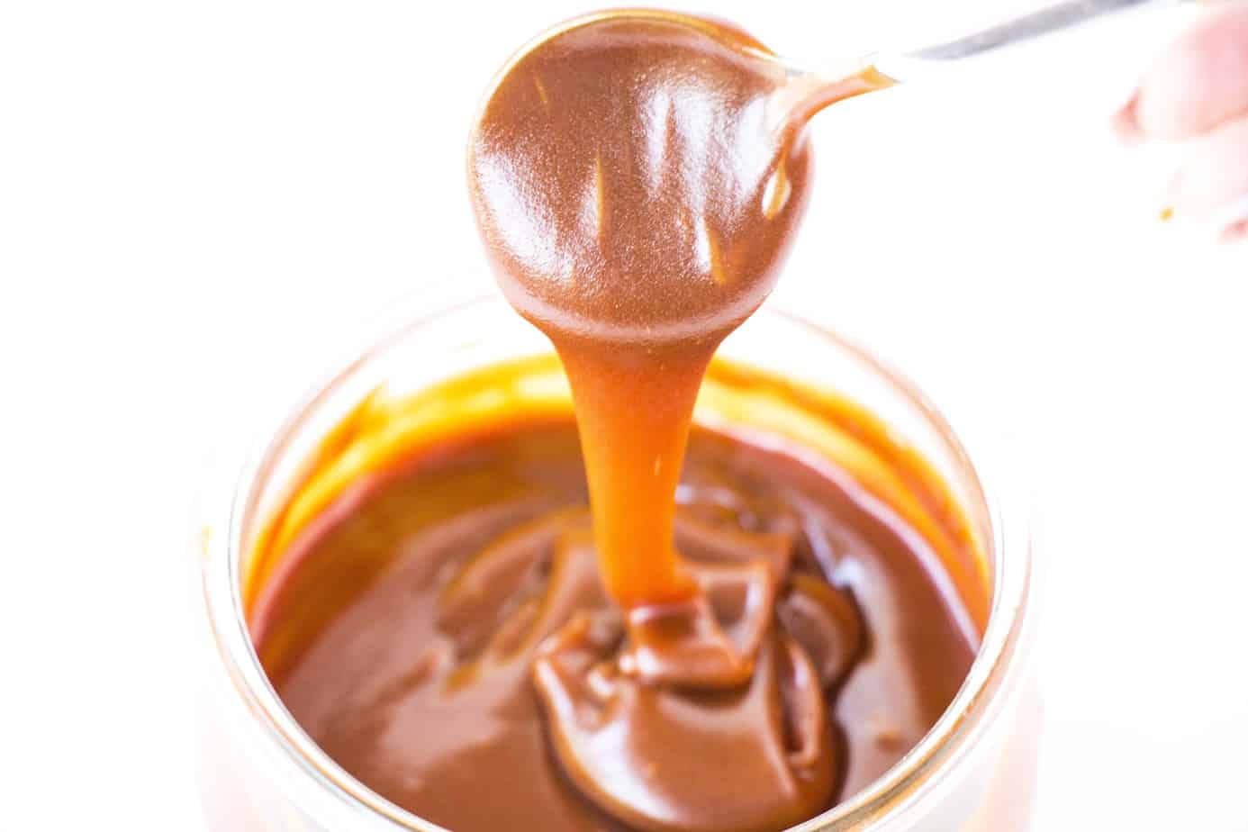 Salted Caramel Sauce dripping from a spoon