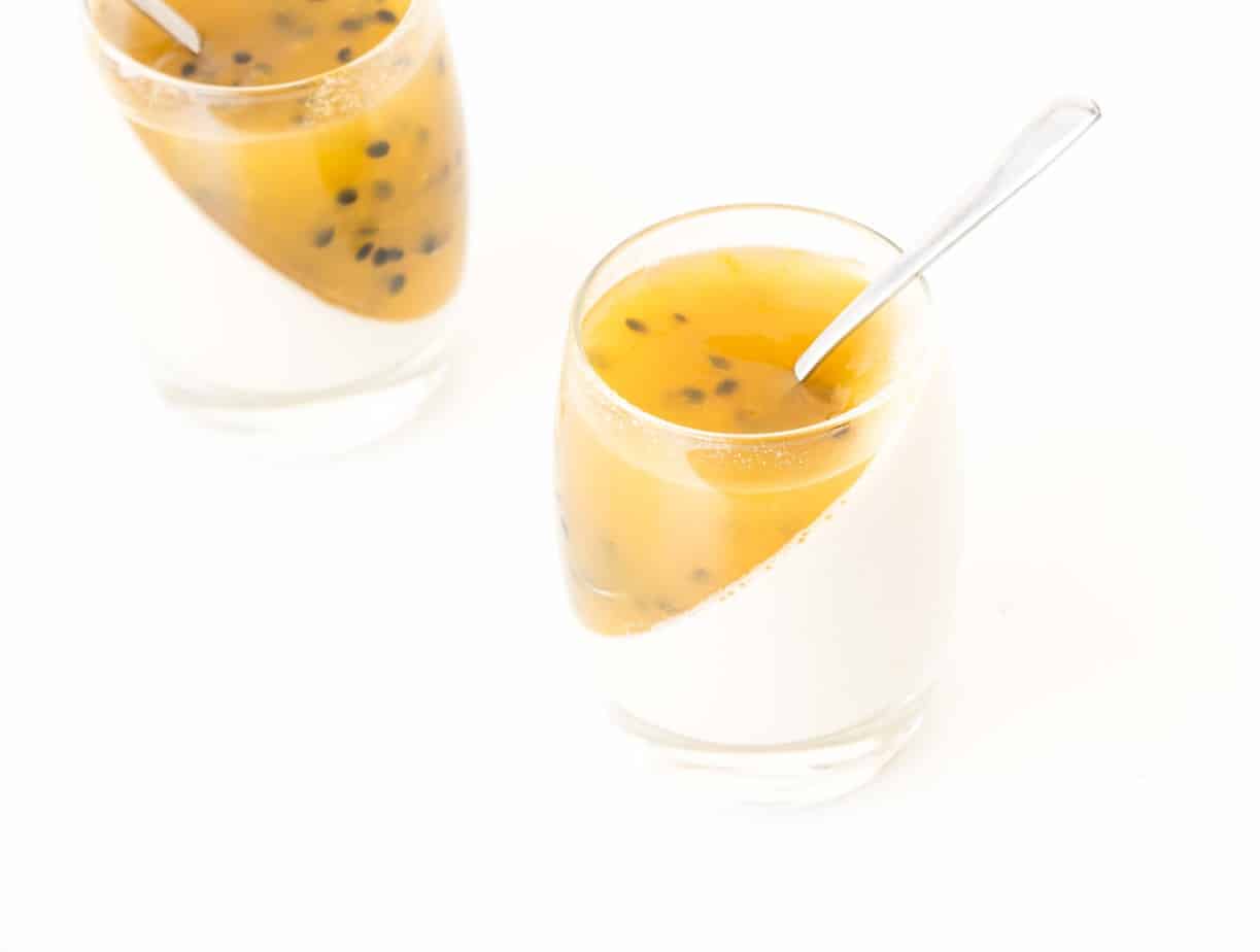 Vegan Passionfruit Panna Cotta with silver spoon.