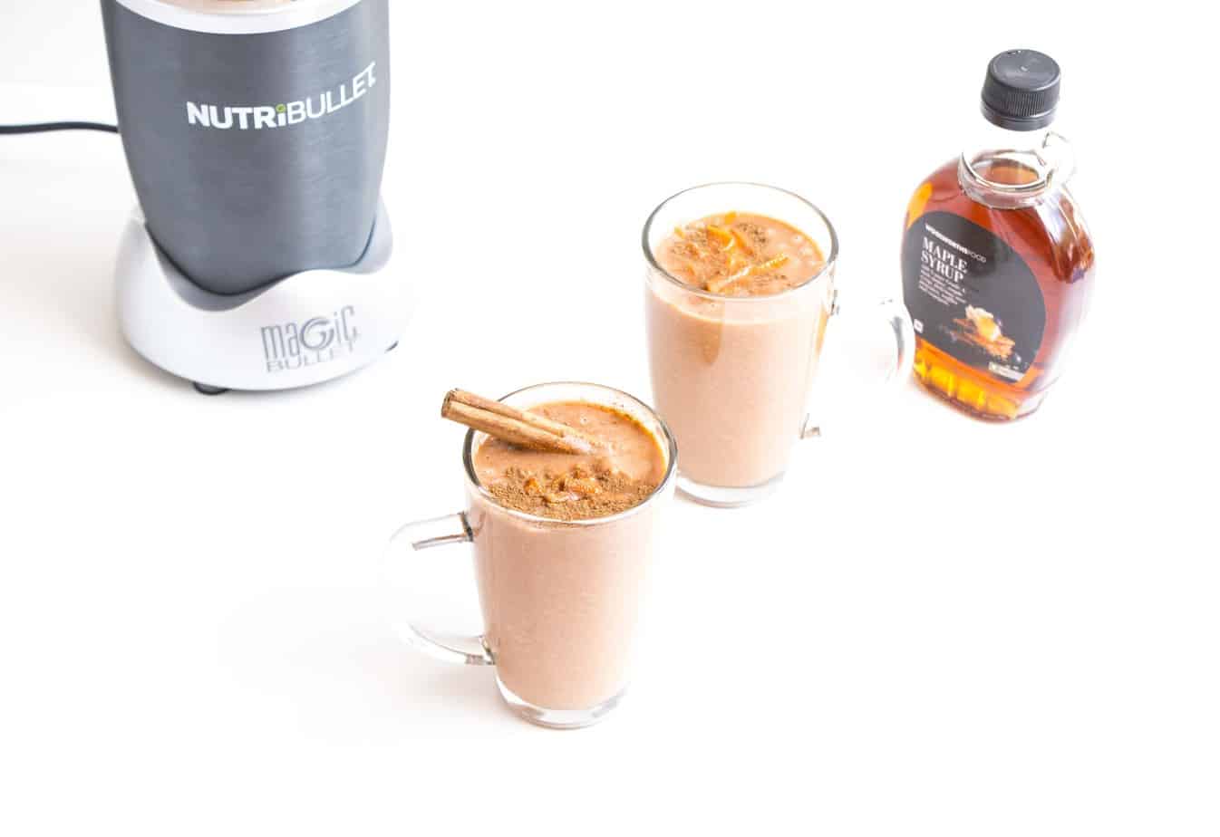 Healthy Carrot Cake Smoothies with a blender and maple syrup.