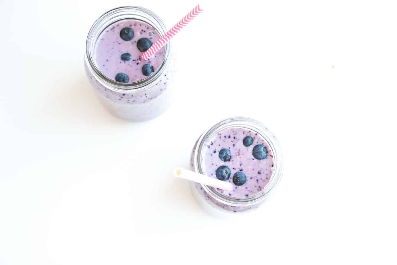 Healthy Blueberry Oat Milk Smoothie from above garnished with fresh blueberries.