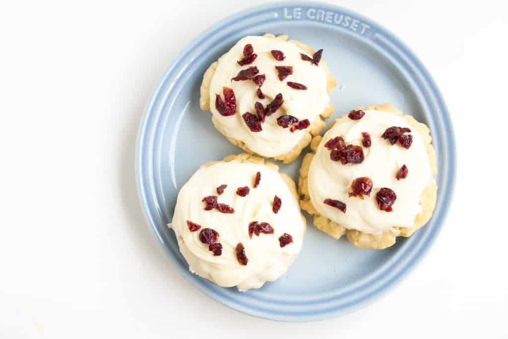 Three cookies on a blue plate.