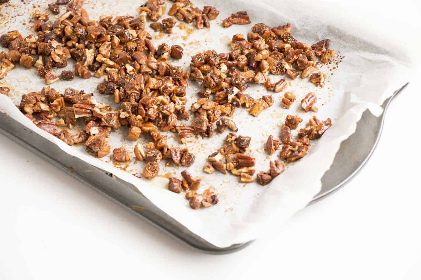 Chopped nuts on a baking tray.