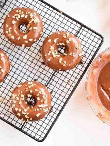 Baked Chocolate Cake Donuts Topped With Nutella Glaze - Easy and delicious donut recipe that will have everyone's mouth watering.
