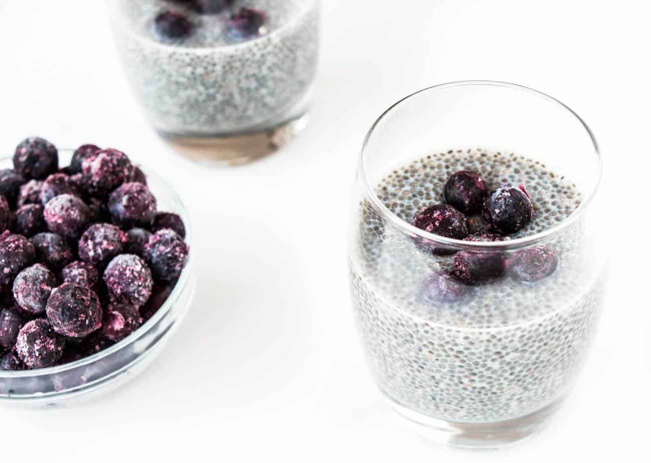 Delicious healthy Vanilla Blueberry Chia Pudding with berries on top.