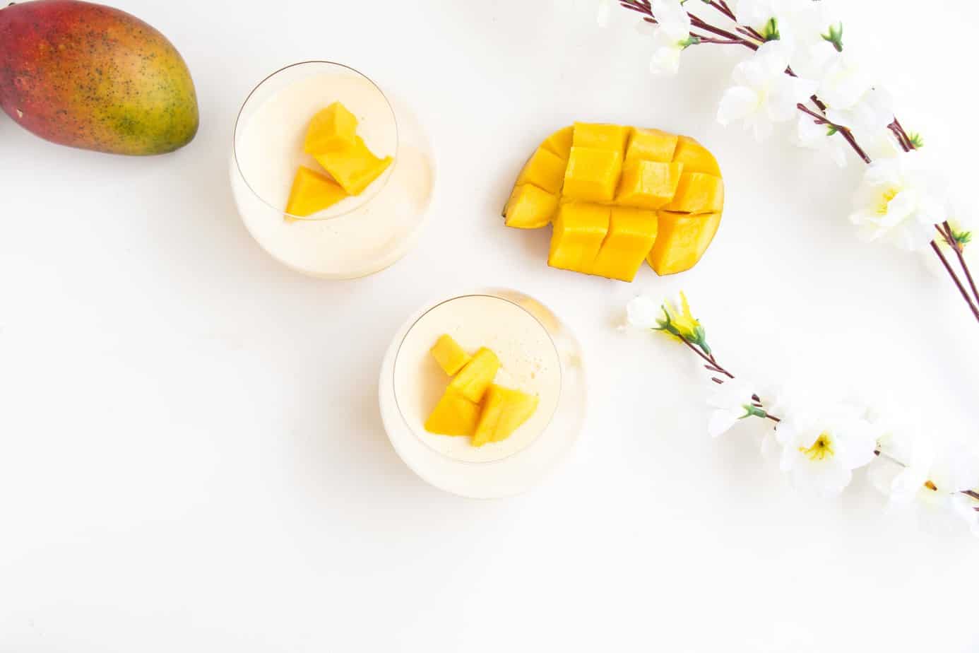 Mango and flowers with a creamy dessert.