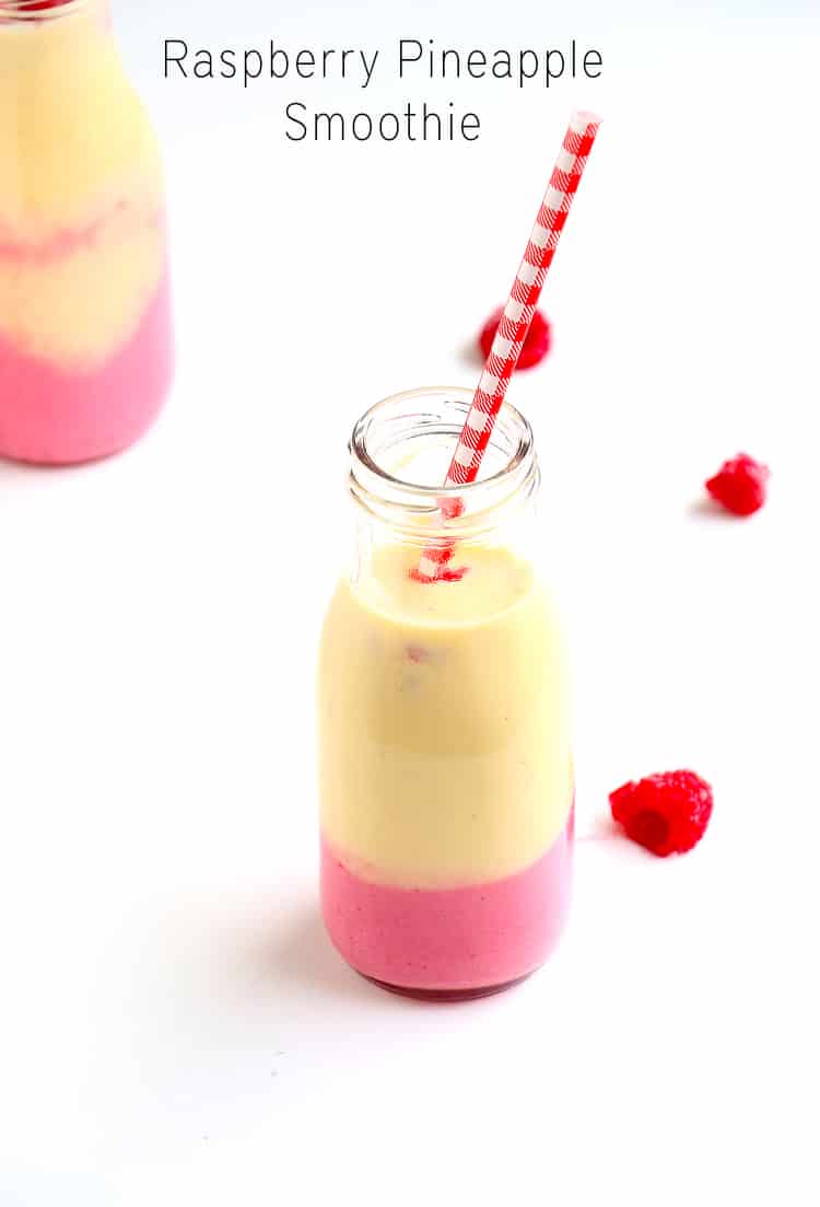 Raspberry Pineapple Smoothie in a glass with a straw