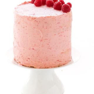 Soft Vanilla Cake with Raspberry Buttercream - A delicious vanilla cake recipe that is easy to make and is perfectly moist and soft. Filled and topped with a delicious and creamy raspberry buttercream.