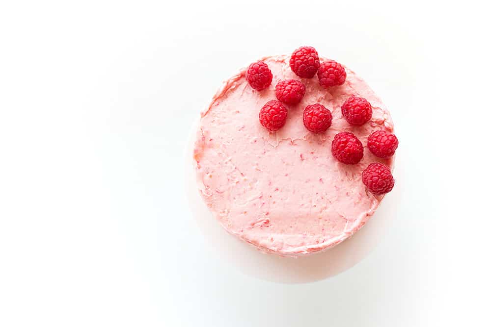 Soft Vanilla Cake with Raspberry Buttercream - A delicious vanilla cake recipe that is easy to make and is perfectly moist and soft. Filled and topped with a delicious and creamy raspberry buttercream.