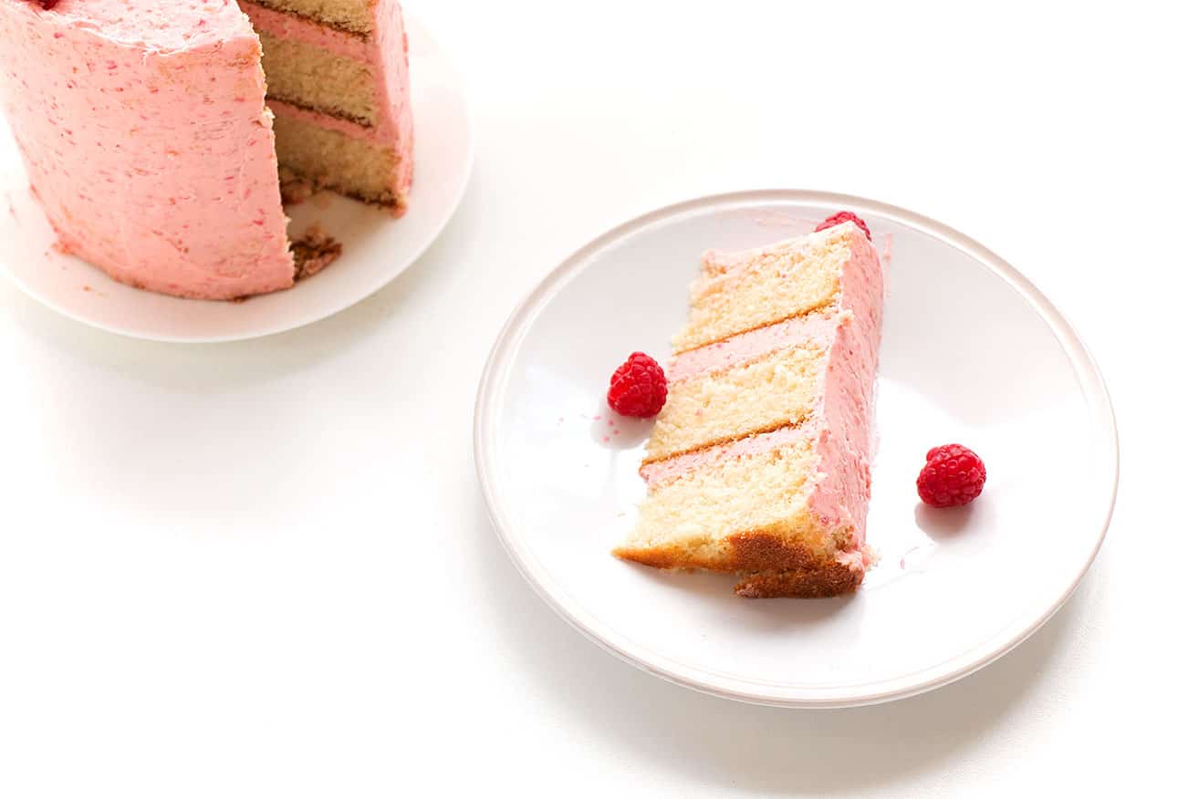 Soft Vanilla Cake with Raspberry Buttercream - A delicious vanilla cake recipe that is easy to make and is perfectly moist and soft. Filled and topped with a delicious and creamy raspberry buttercream.