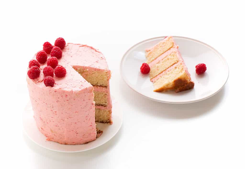 Soft Vanilla Cake with Raspberry Buttercream - A delicious vanilla cake recipe that is easy to make and is perfectly moist and soft. Filled and topped with a delicious and creamy raspberry buttercream.