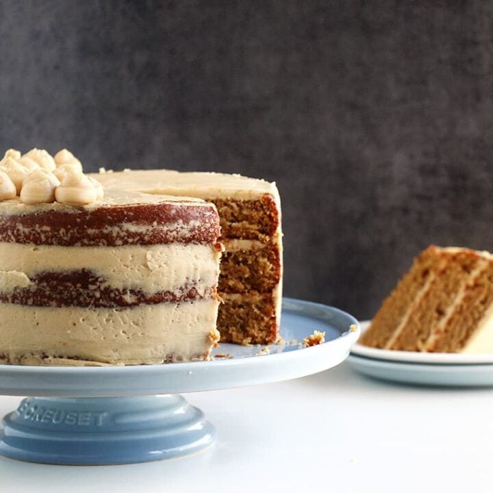 Moist Layered Coffee Cake - A soft 3 layered naked coffee cake with a delicious silky coffee Italian meringue buttercream. With an instructional video on how to easily decorate it.