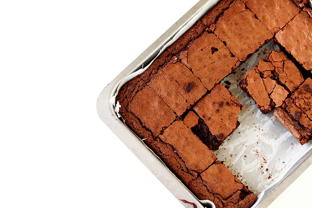 A tray of brownies cut into squares.