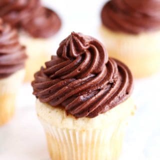 The ultimate go to cupcake recipe, this moist vanilla cupcake recipe with creamy chocolate frosting only takes a few minutes to whip up and can be frozen for up to a few weeks! The only cupcake recipe you will ever need!