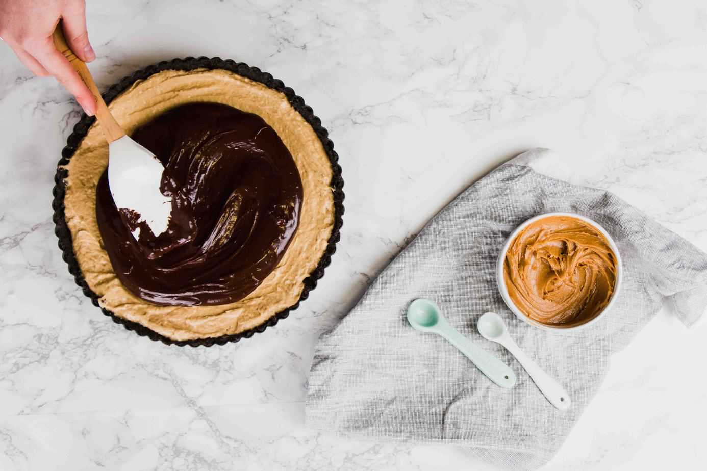 This Vegan Peanut Butter Chocolate Tart is the ultimate no-bake decadence. No one will even know it's vegan! Made with oreos, peanut butter and a little coconut oil and cream!