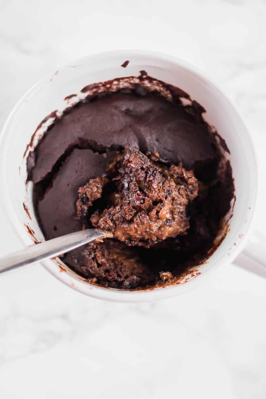 The ultimate healthy vegan chocolate mug cake that only takes a few minutes to whip up and is the perfect guilt-free treat! Easy and delicious!