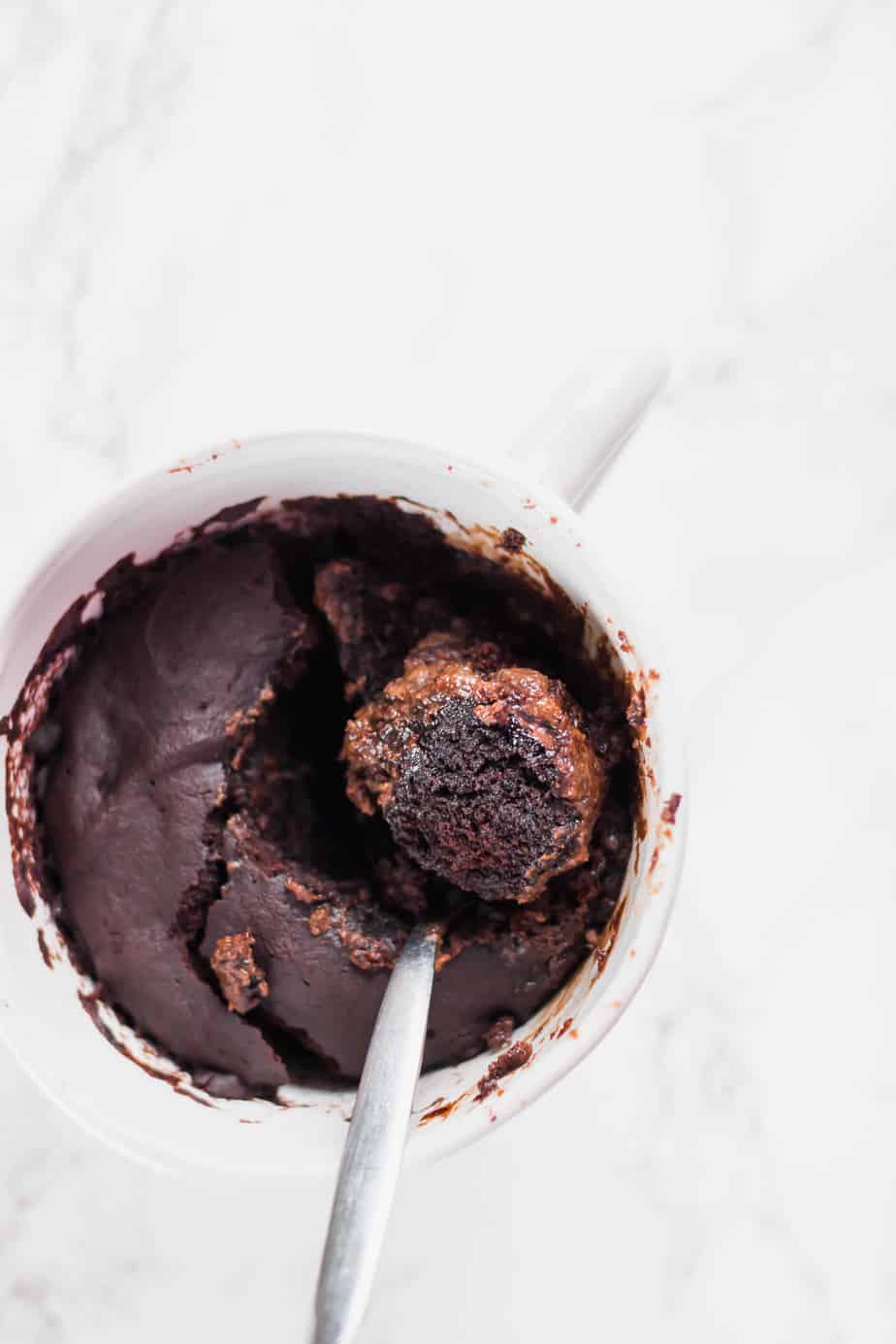 The ultimate healthy vegan chocolate mug cake that only takes a few minutes to whip up and is the perfect guilt-free treat! Easy and delicious!