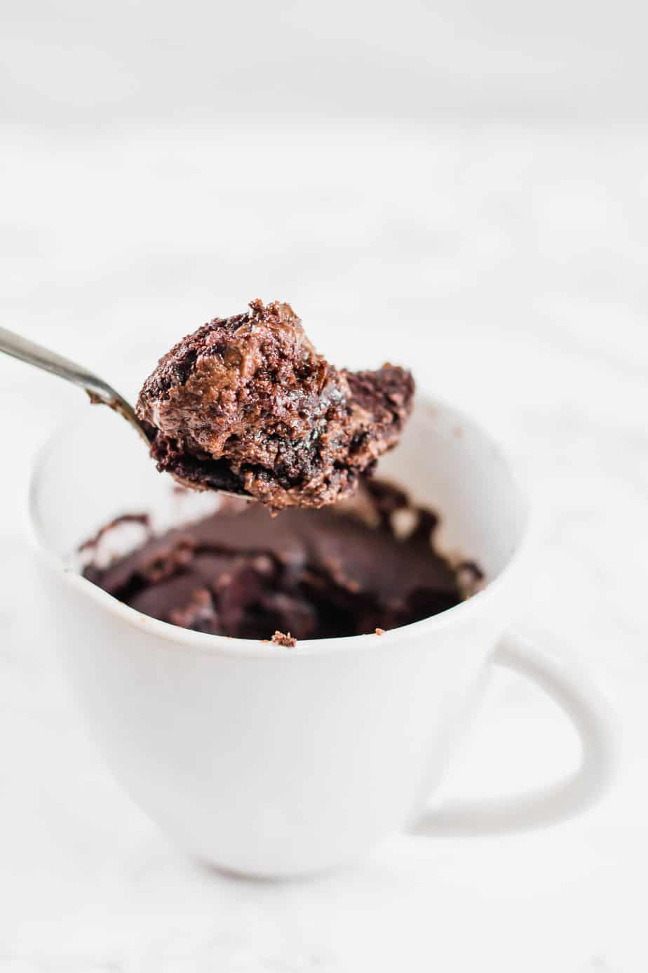 The ultimate healthy vegan chocolate mug cake that only takes a few minutes to whip up and is the perfect guilt-free treat! Easy and delicious!