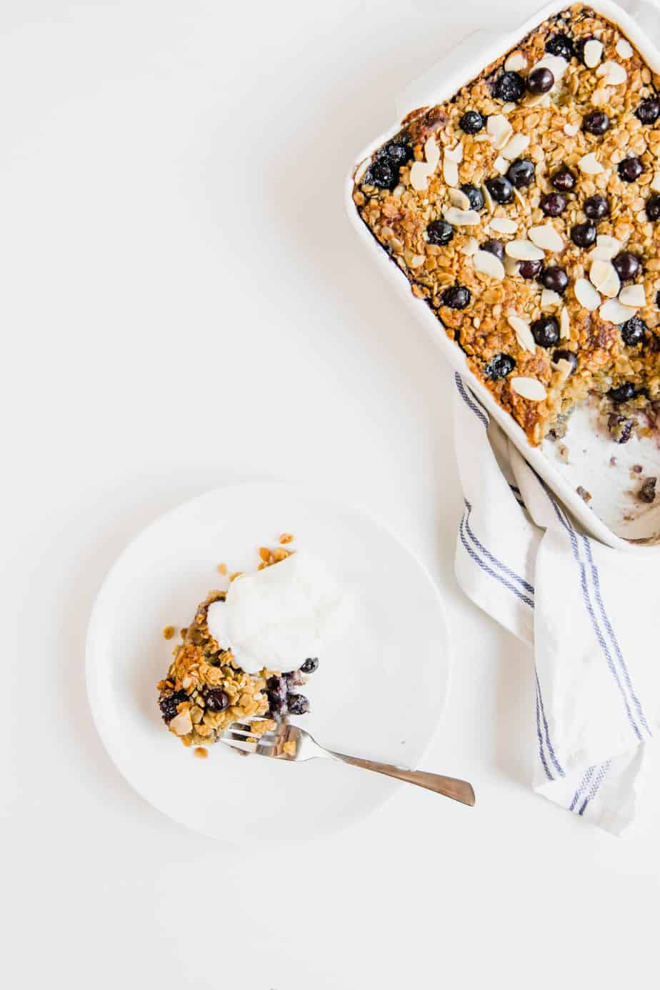 Blueberry Baked Oatmeal served in a bowl with a silver fork.