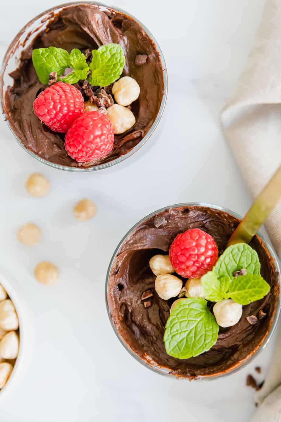 Vegan chocolate mousse with mint and fresh berries.