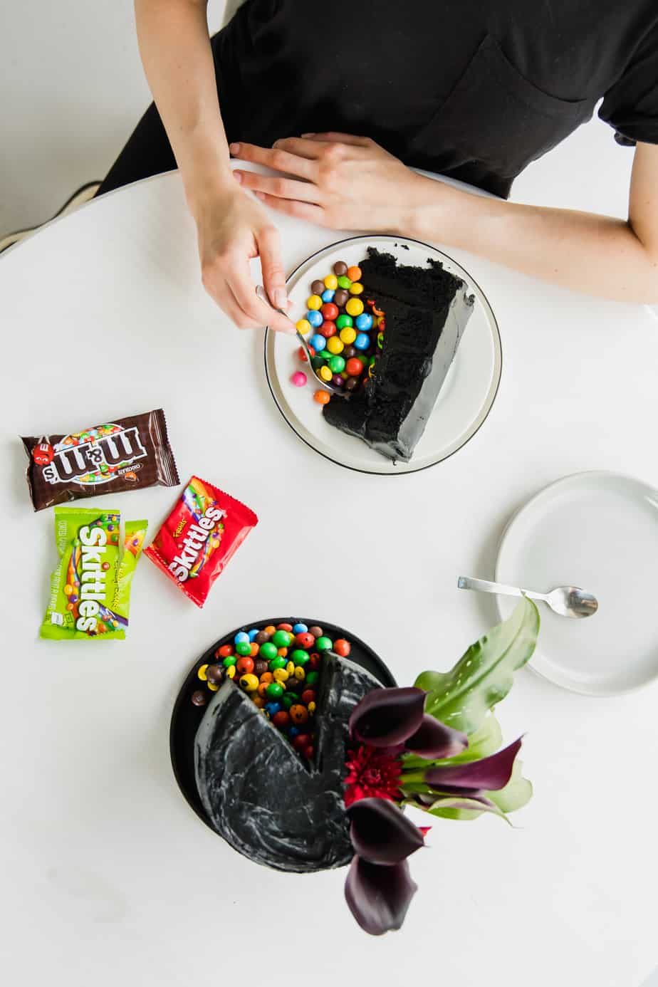 Layers of velvety black, moist cake, covered in the softest black frosting and of course filled with my favourite Skittles & M&M's! This is the ultimate Halloween cake, with a classy twist of course!