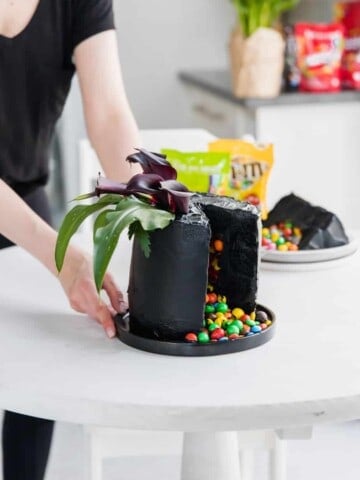 Layers of velvety black, moist cake, covered in the softest black frosting and of course filled with my favourite Skittles & M&M's! This is the ultimate Halloween cake, with a classy twist of course!