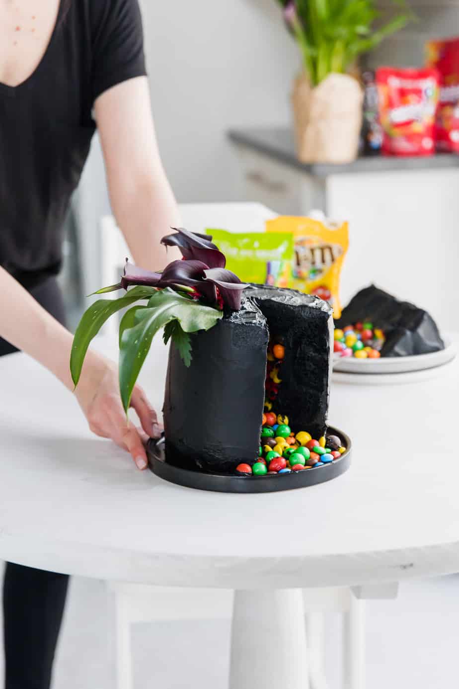 Layers of velvety black, moist cake, covered in the softest black frosting and of course filled with my favourite Skittles & M&M's! This is the ultimate Halloween cake, with a classy twist of course!