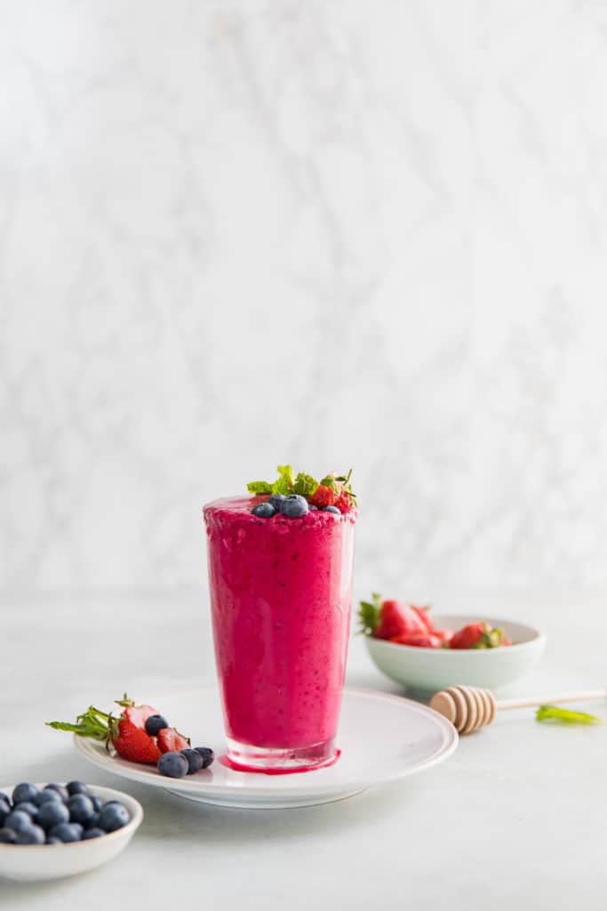 A Strawberry Beetroot Detox Smoothie with fresh berries.