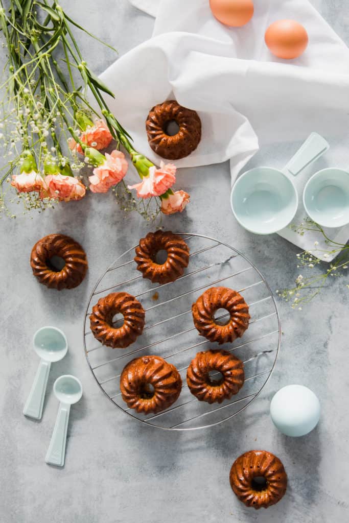 Delicious and beautiful twist on the classic hot cross buns, these Hot Cross Bundt Cakes are sure to be a spicy hit this Easter. Super easy to make, a crowd pleaser and decadently delicious.