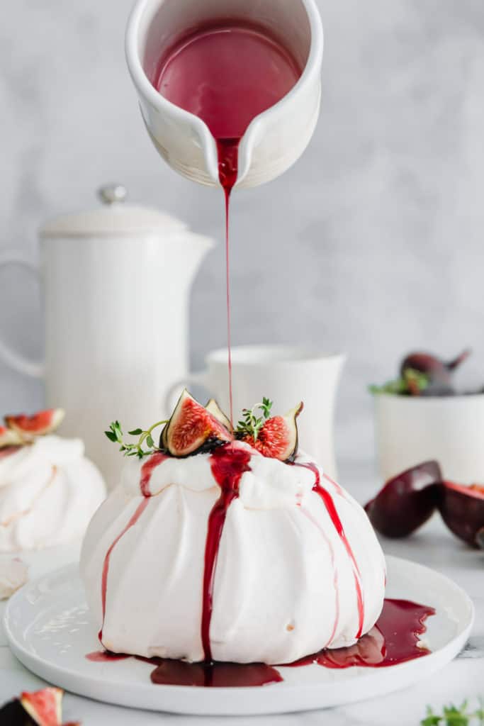 This Fig & Thyme Pavlova with Spicy Red Wine Plum Syrup is the only dessert recipe you'll ever need. Elegant, fruity and just a touch of spice. Perfect for any season.
