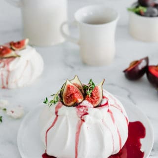 This Fig & Thyme Pavlova with Spicy Red Wine Plum Syrup is the only dessert recipe you'll ever need. Elegant, fruity and just a touch of spice. Perfect for any season.