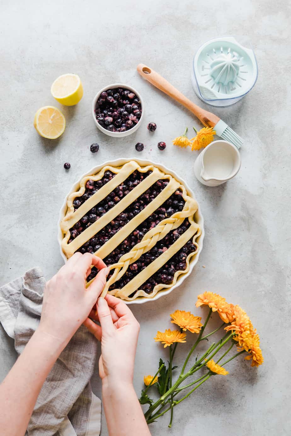 An unbaked pie with berries and pastry.