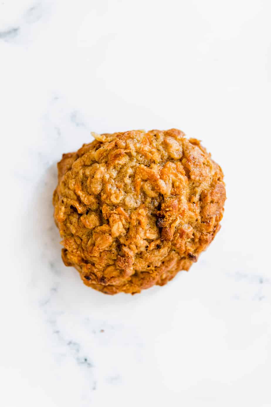 A Healthy Cinnamon Carrot Cookie on a marble background.