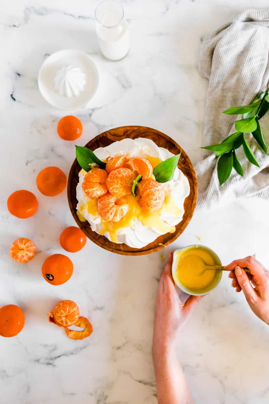 A pavlova with clementine curd and fresh fruit.