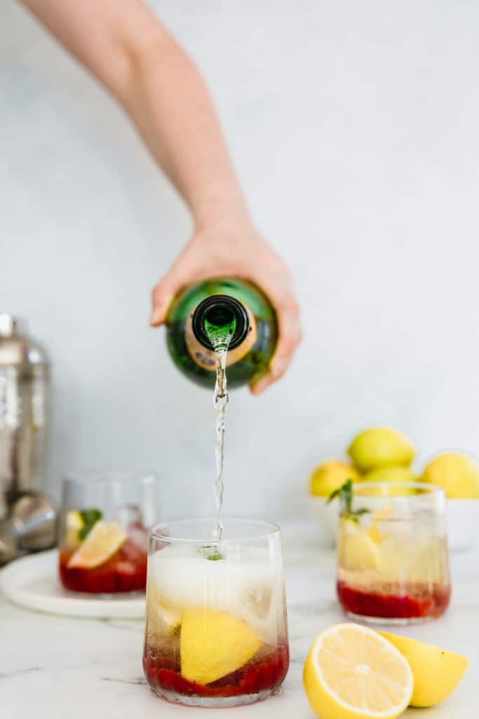 his sweet and fruity Strawberry Champagne Cocktail is deliciously refreshing. Made with fresh strawberries and lots of mint and ice, it is the perfect summer cocktail. I can't think of a better way to stay cool this summer! 