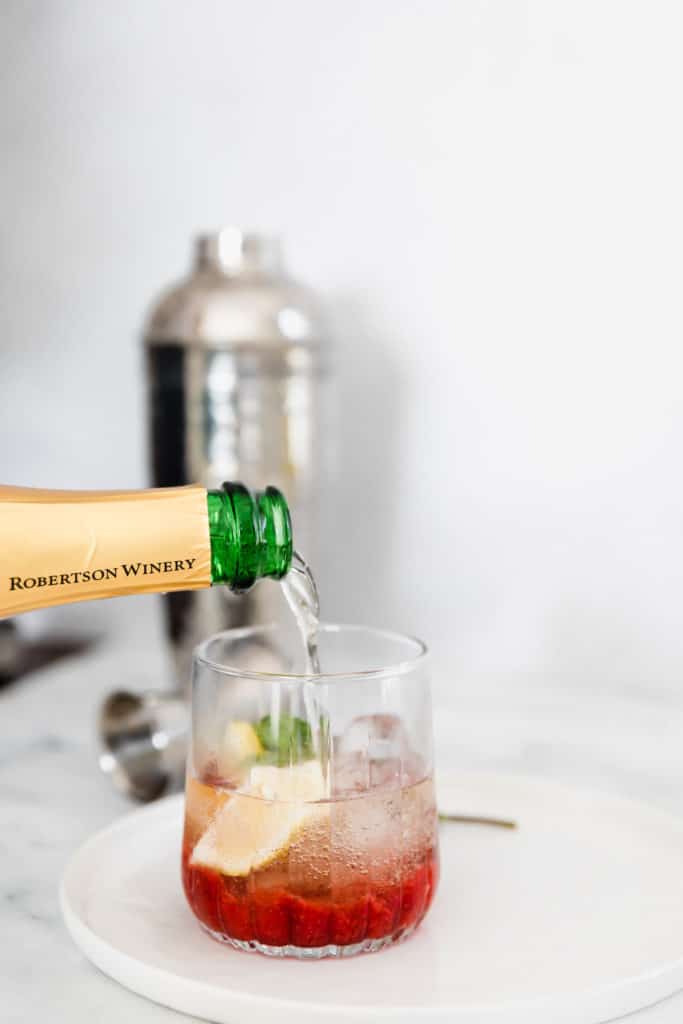 his sweet and fruity Strawberry Champagne Cocktail is deliciously refreshing. Made with fresh strawberries and lots of mint and ice, it is the perfect summer cocktail. I can't think of a better way to stay cool this summer! 