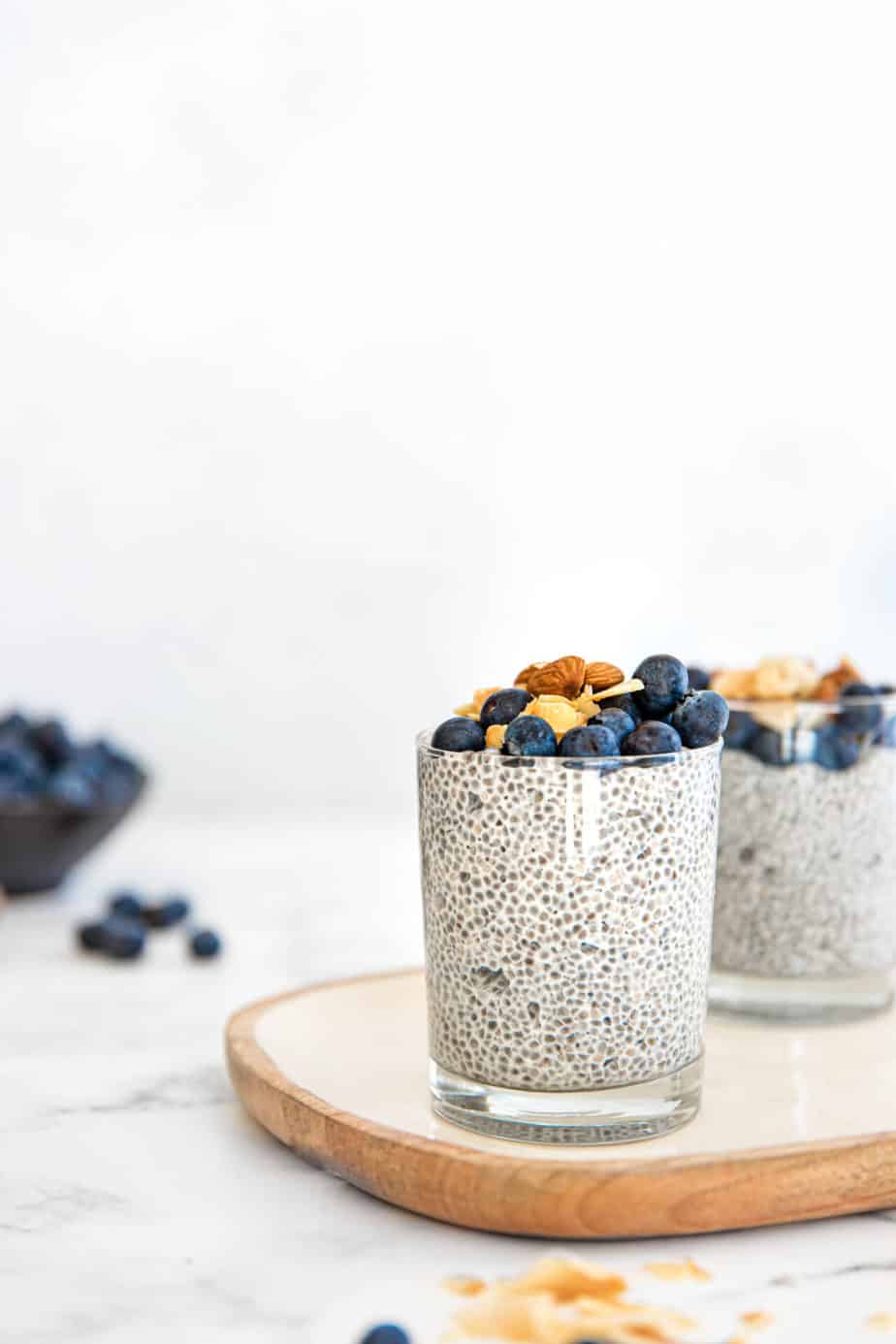 Chia Puddings in glasses with fresh berries