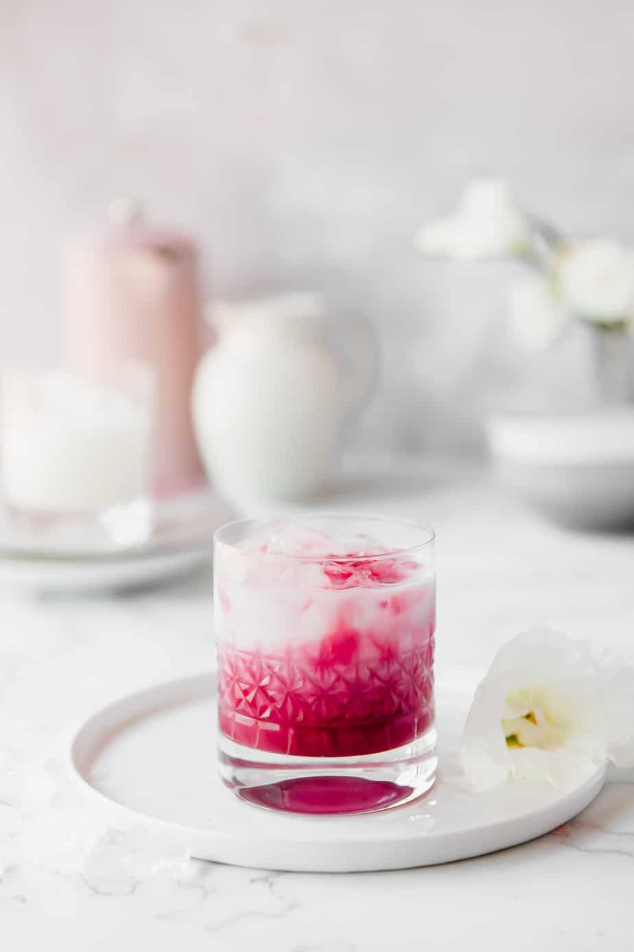 An Homemade Iced Beetroot Latte with Coconut Milk in a glass.