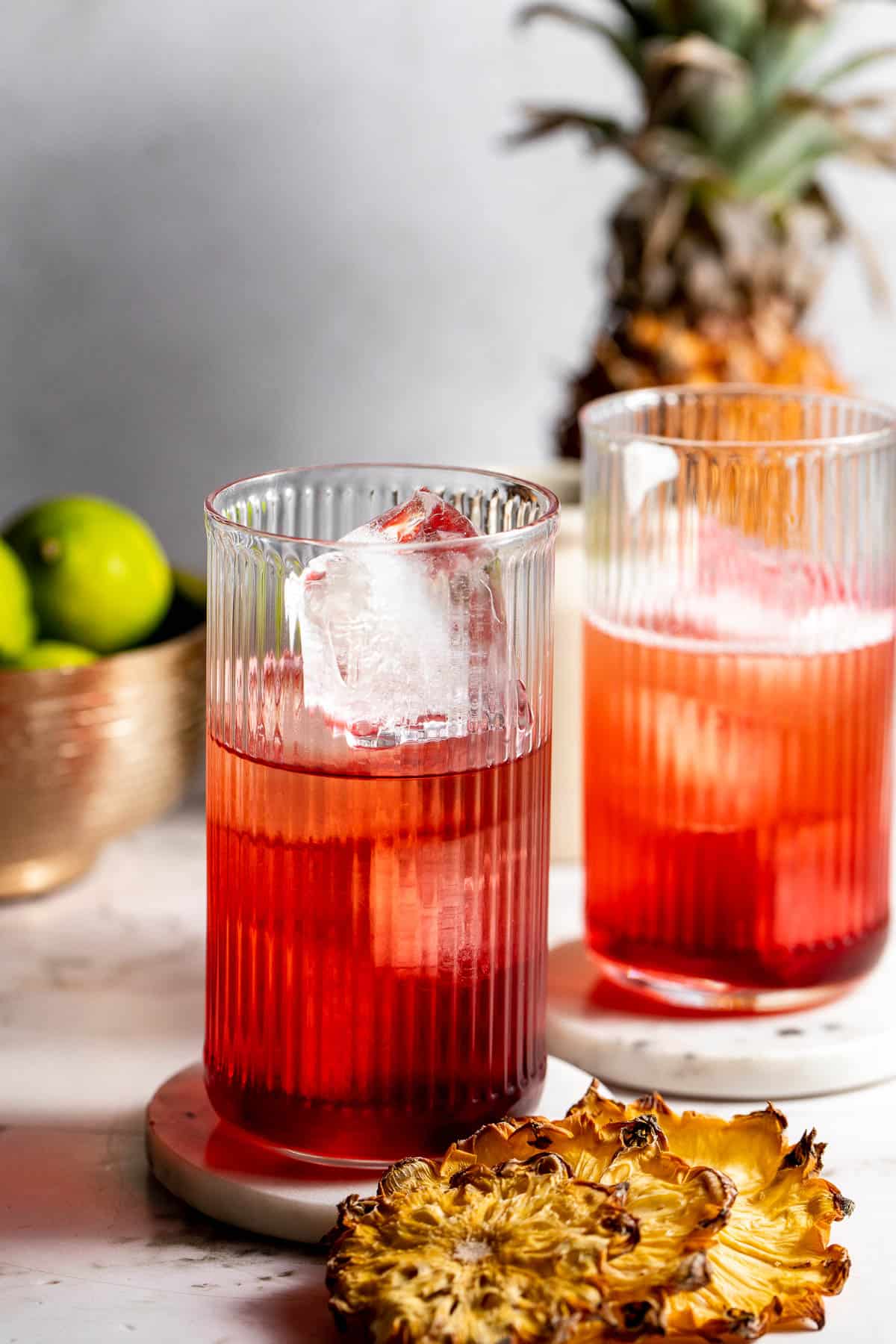 two glasses with ice and cranberry juice