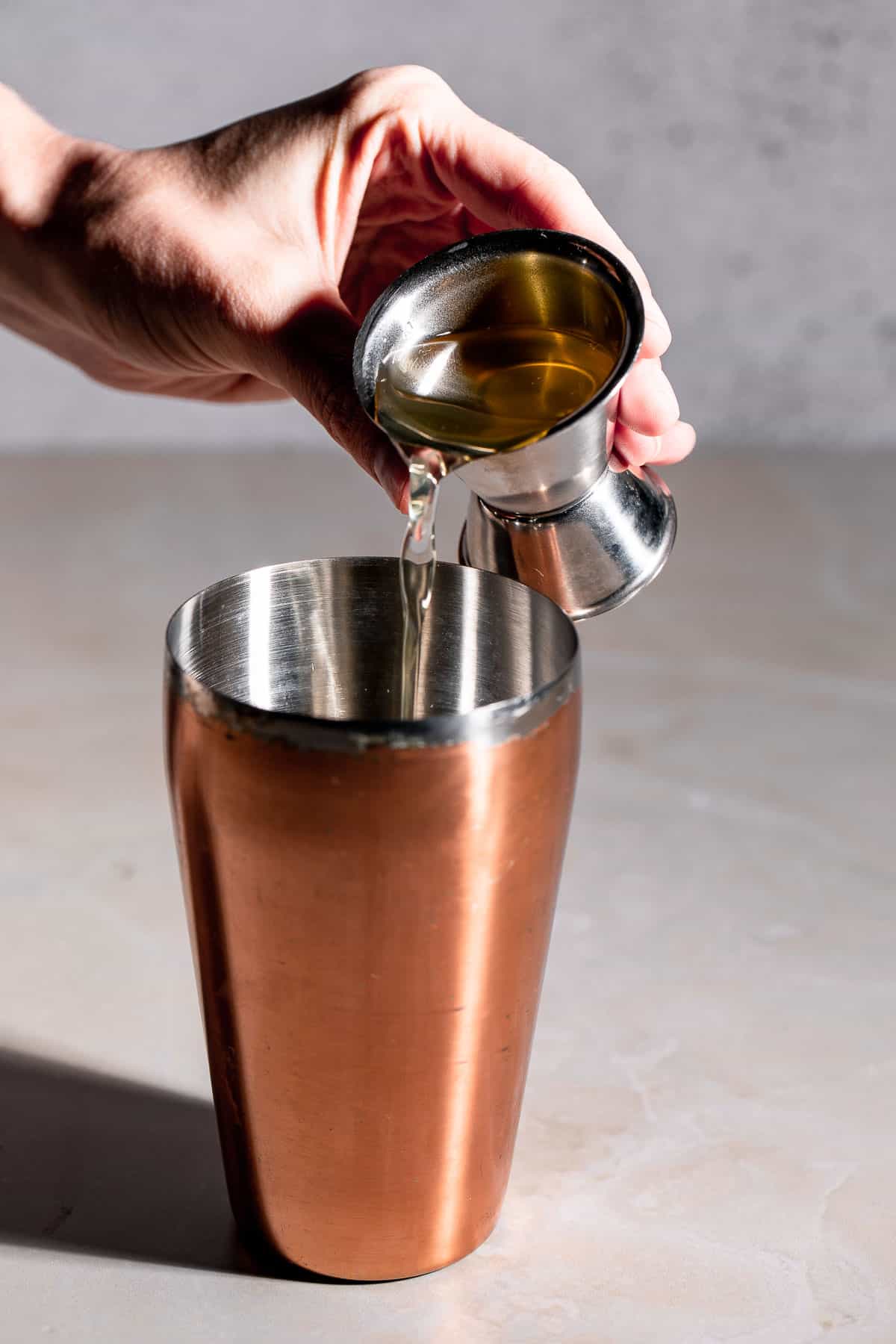 gold cocktail shaker and jigger