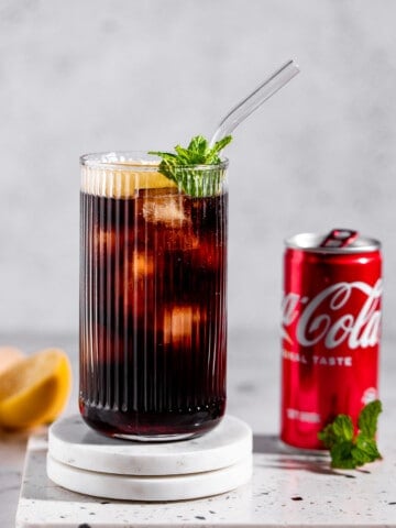 roy rogers mocktail in highball glass with tin of coke
