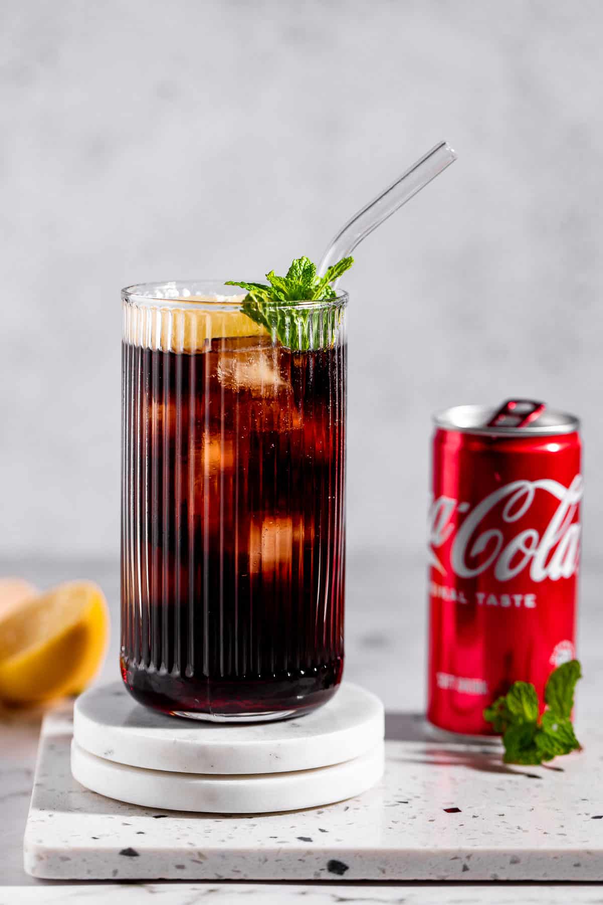 roy rogers mocktail in highball glass with tin of coke