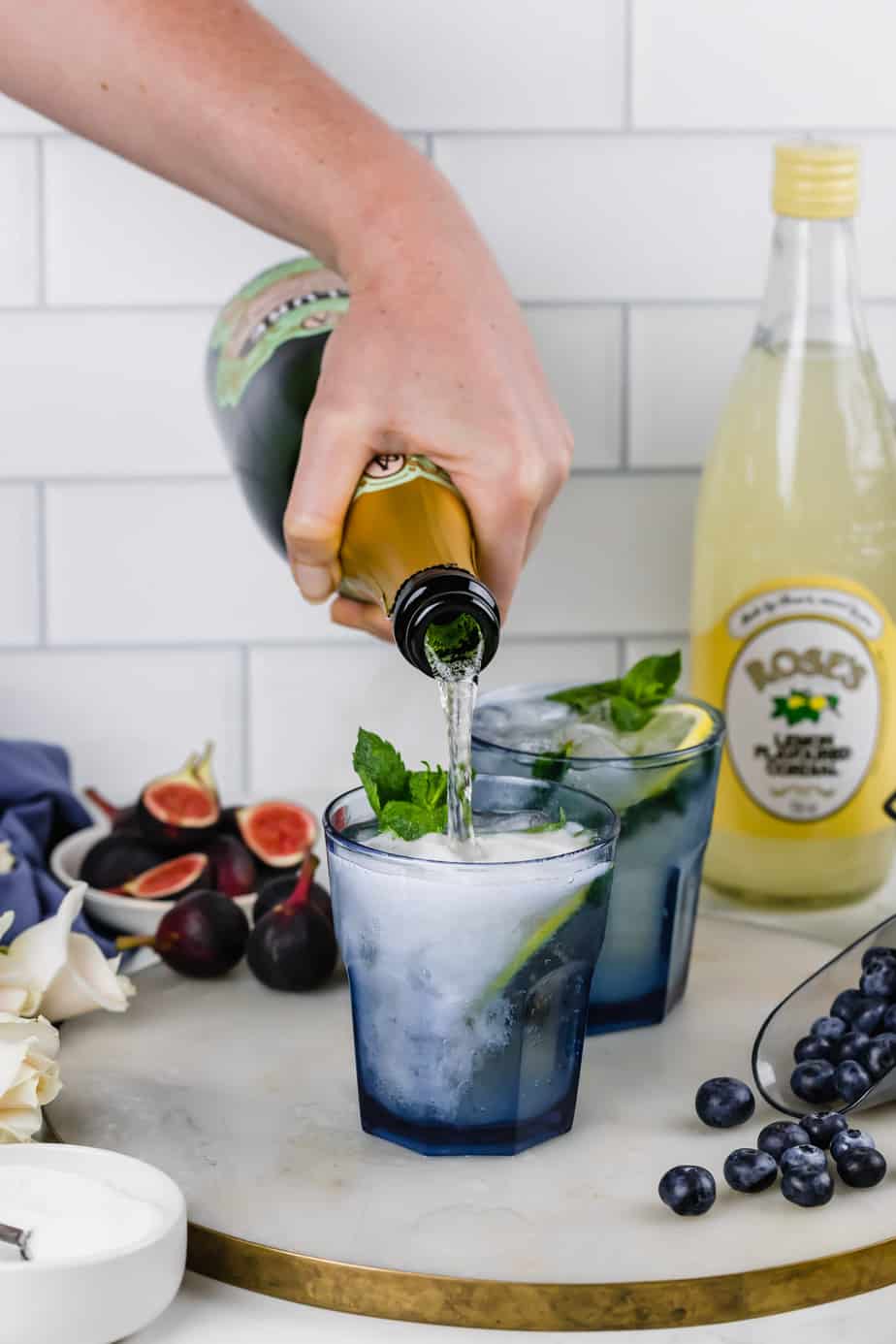 Champagne mojito cocktail with fresh mint and lemons