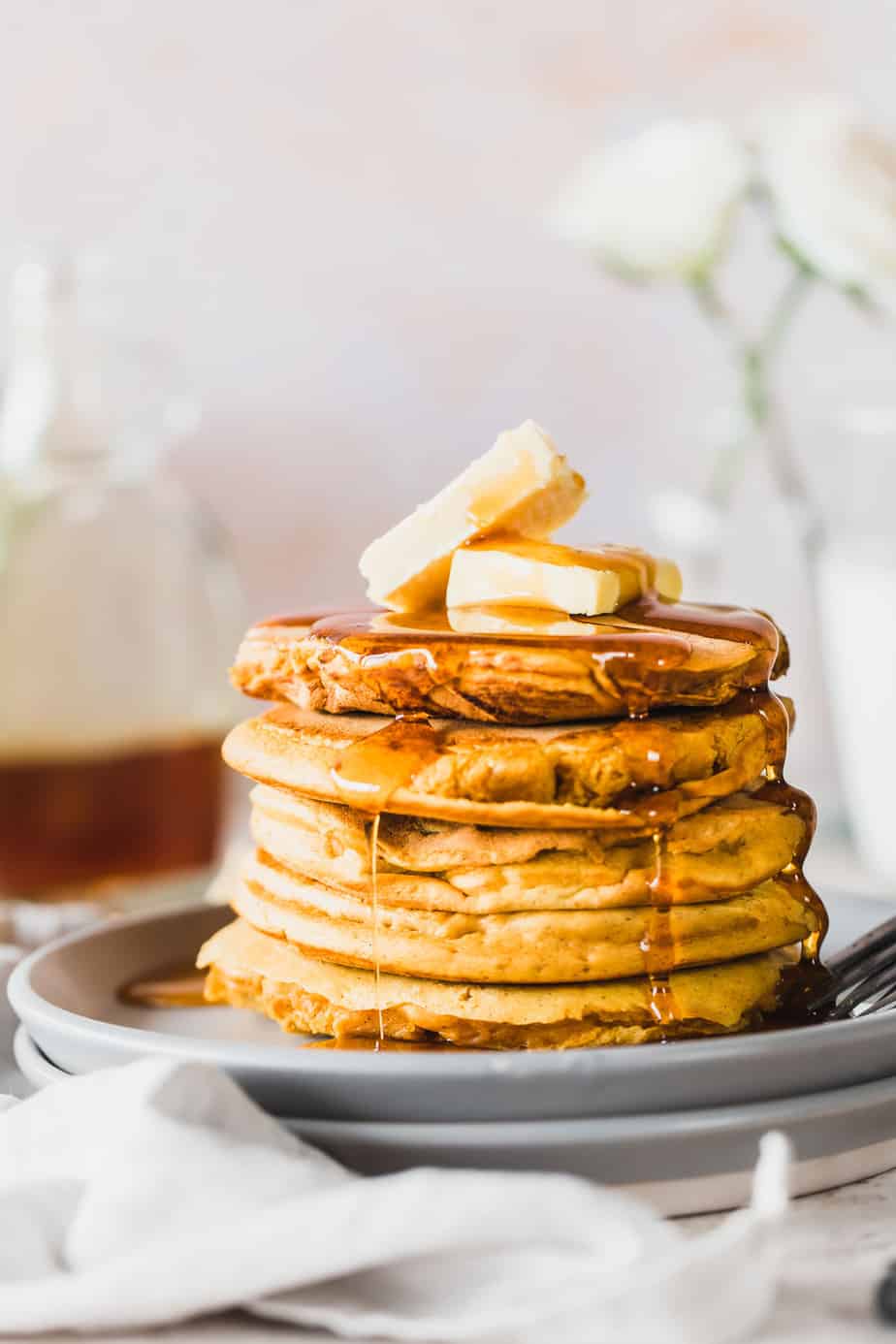 Vegan Pumpkin Pancakes with maple syrup and vegan butter